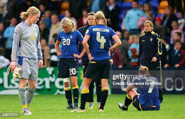 Hedvig Lindahl, Josephine Oqvist and Hanna Marklund of Sweden stand dejected after losing in extra time during UEFA Women's Championship Semi Final...
