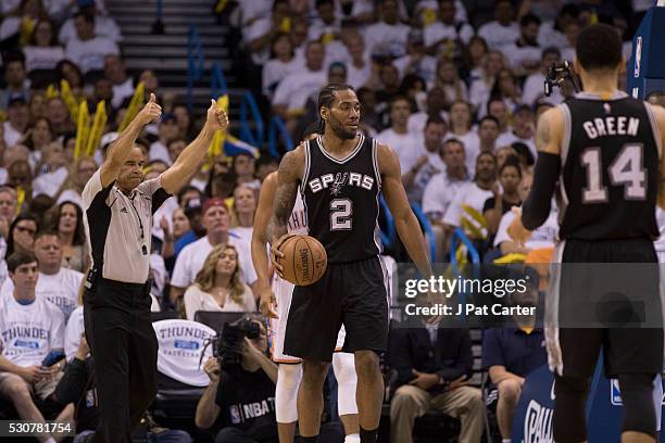 Kawhi Leonard of the San Antonio Spurs pauses during game action against the Oklahoma City Thunder during Game Four of the Western Conference...