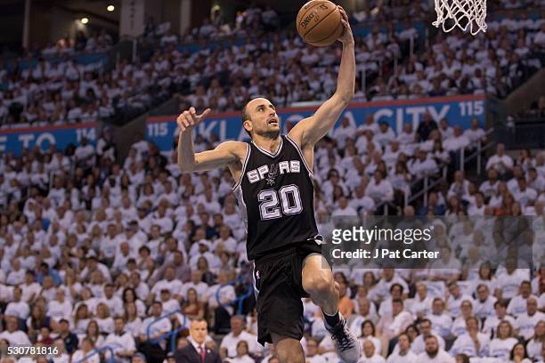Manu Ginobili of the San Antonio Spurs brings the ball up court against the Oklahoma City Thunder during Game Four of the Western Conference...