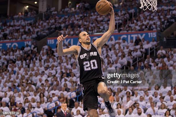 Manu Ginobili of the San Antonio Spurs brings the ball up court against the Oklahoma City Thunder during Game Four of the Western Conference...