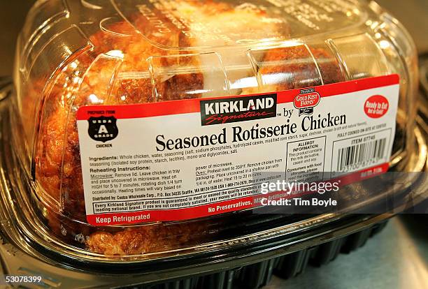 Kirkland Signature premium brand roasted rotisserie chicken sits at a Costco store June 16, 2005 in Niles, Illinois. The larger "big box" stores such...