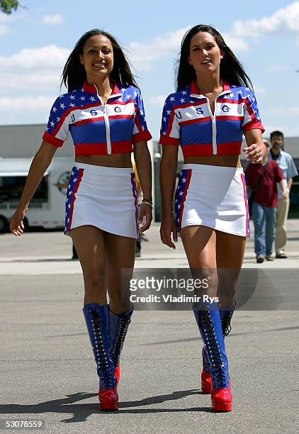 Pit girls are seen walking in the paddock during the previews to the US F1 Grand Prix on June 16, 2005 in Indianapolis, Indiana.