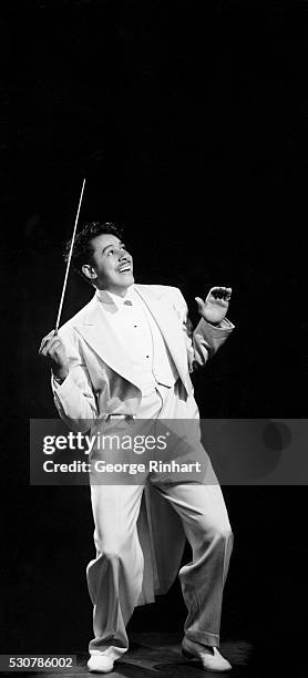 Legendary Big Band leader, Cab Calloway, who got his big break in 1929 when he first played at the Cotton Club in Harlem, wearing a white tuxedo with...