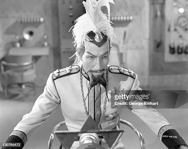 Scene from "Flash Gordon Conquers the Universe," in which Emperor Ming the merciless of Mongo broadcasts orders to his henchmen to destroy the...
