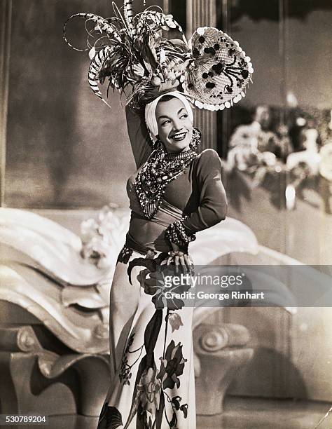 Carmen Miranda dances in a scene from the movie 'Week-End In Havana' , 1941.
