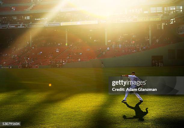 Rick Porcello of the Boston Red Sox warms up in center field before the game against the Oakland Athletics at Fenway Park on May 11, 2016 in Boston,...