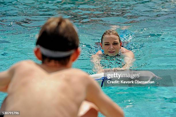 Founder, Princess Charlene of Monaco Foundation, Princess Charlene of Monaco teaches children how to swim and practice water safety at The Princess...