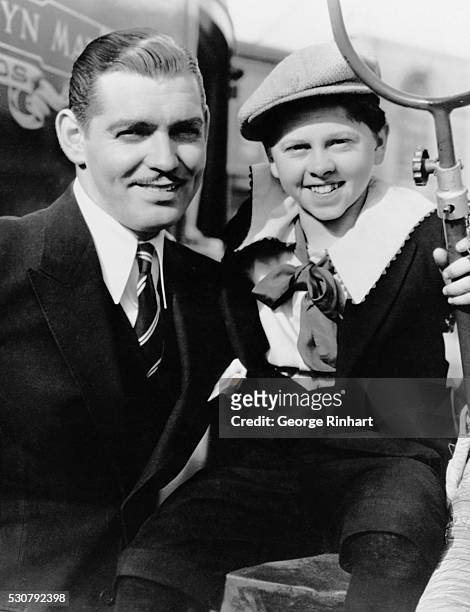 Clark Gable poses with Mickey Rooney, who played the former as a young boy in the 1937 MGM film, Manhattan Melodrama.