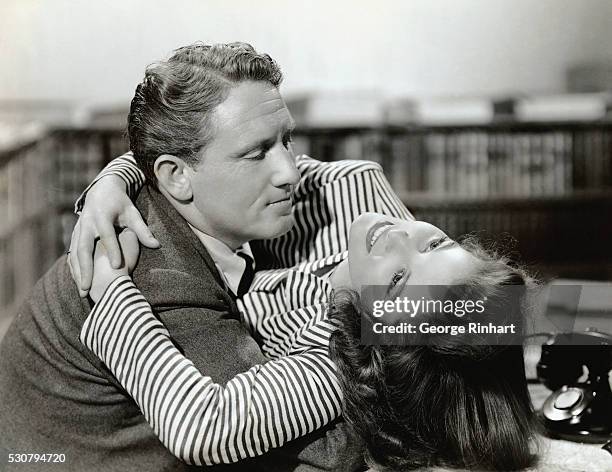 Katharine Hepburn and Spencer Tracy hugging in Woman of the Year.