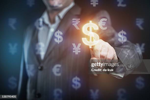 businessman pressing us dollar symbol - rupee stock pictures, royalty-free photos & images