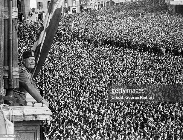 Benito Mussolini addressing crowds on during the Declaration of the Italian Empire, May 9 in the Palazzo Venezia in Rome, Italy.