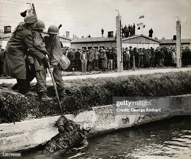 The U.S. Seventh Army Divisions, capturing Dachau Concentration camp in Germany on April 30 found horrors worse than those found in the Nazi camps of...