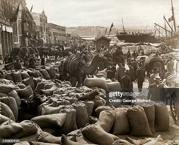 Typical scene in Smyrna, during the shipping sesaon for figs. The streets and squares of the Asia Minor town are literally crammed with sacks of...