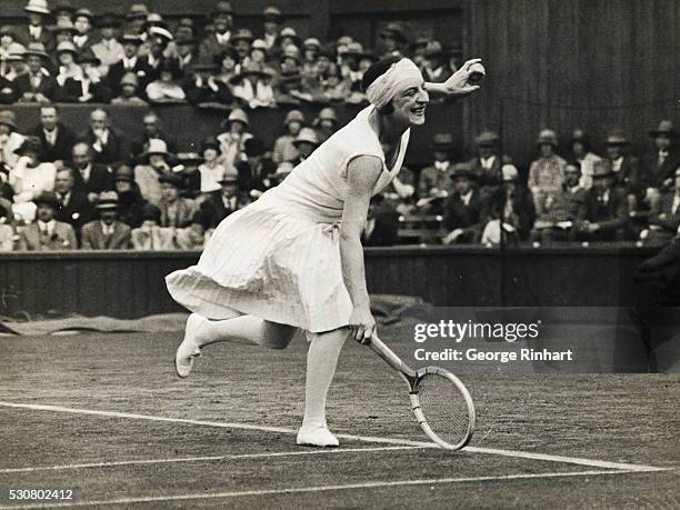 Mlle. Lenglen defeated Miss Mary K. Browne, the American, by 6-2, 6-3, at Wimbledon. Photo shows Mlle. Lenglen in play against Miss Browne.