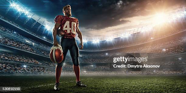 american football player - soccer glove stock-fotos und bilder