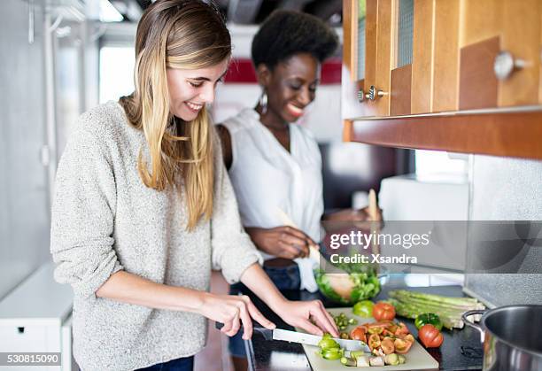 friends cooking - woman salad stockfoto's en -beelden