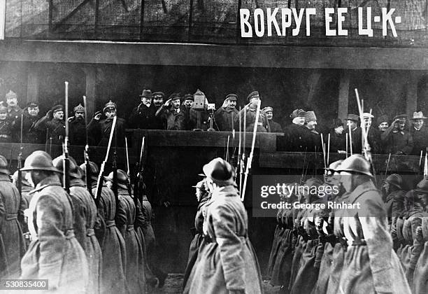 Soviet officials, including Joseph Stalin, watch military parade celebrating the anniversary of October Revolution here in Red Square. On the podium...