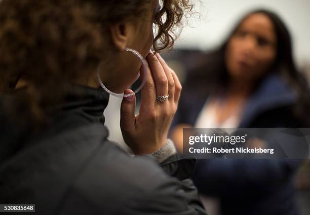 View, from behind, of an unidentified victim of sex trafficking as she speaks with a counselor at My Life My Choice, an anti-human trafficking...