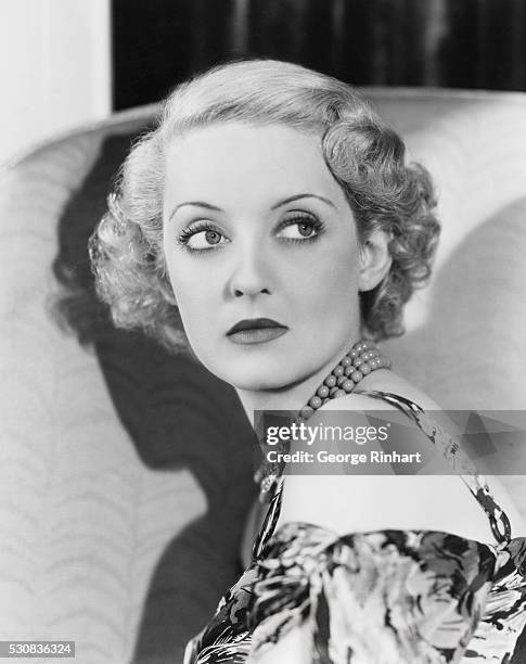 Profile of Actress Bette Davis in Flowered Dress and Pearls