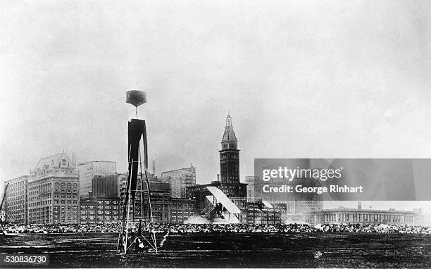 As Chicago looked in 1911-- this scene, snapped at the 1911 Chicago Air Meet, a Wright pusher, is shown rounding a pylon against the sky line of...