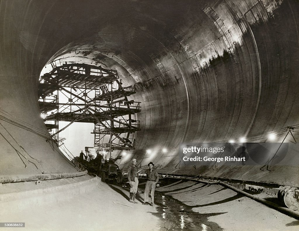 Construction Workers Inside Dam Tunnel