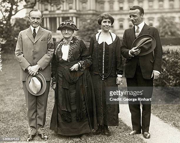 The President and Mrs. Coolidge are seen at the White House with their two latest pledged voters: Theodore Roosevelt, Jr., Assistant Secretary of the...