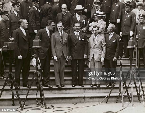 Great Reception Given to Gallant French Flyers. New York: Photo shows: On the steps of City Hall where the flyers were officially welcomed, left to...