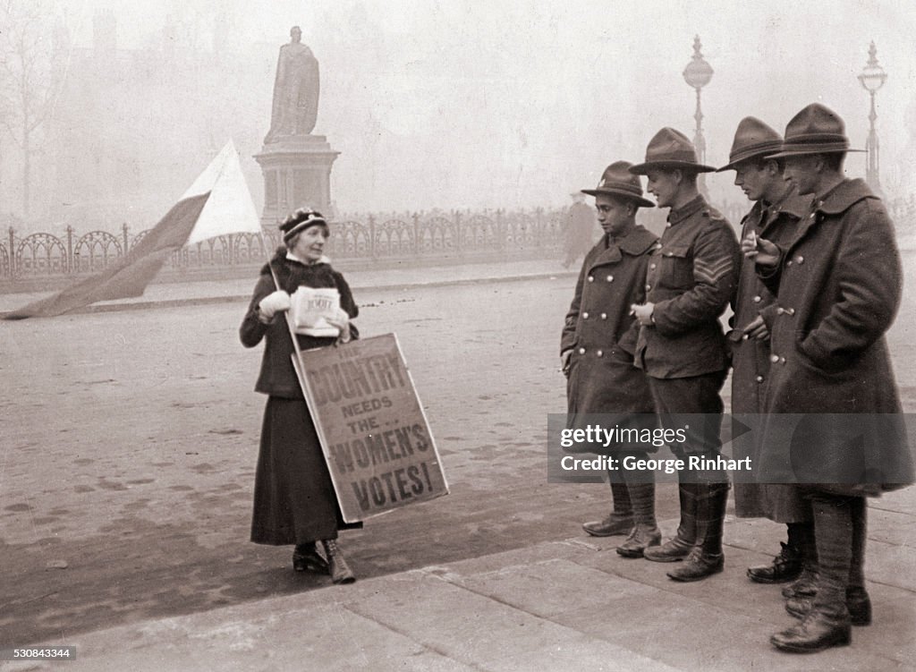 Soldiers Reading Woman's Sign
