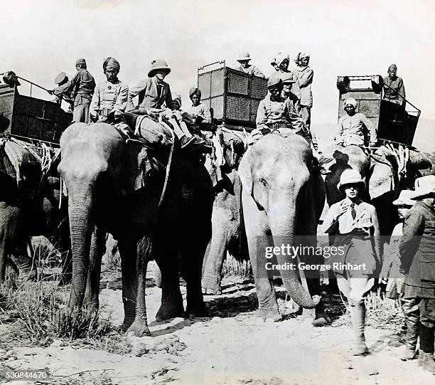 The Prince of Wales watches, from the top of an elephant, the completion of preparations for a hunting expedition into the jungles of Nepal on the...