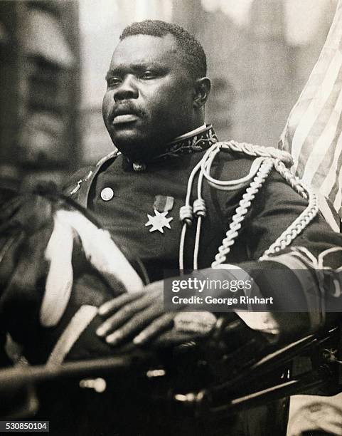 Photo shows Marcus Garvey, High Commissioner General, riding in the giant parade through Harlem, which today opened the annual World Convention in...