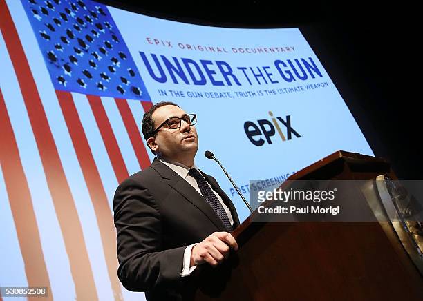 Monty Sarhan, EVP, EPIX, gives opening remarks at the UNDER THE GUN DC premiere featuring Katie Couric and Valerie Jarrett at the Burke Theater at...