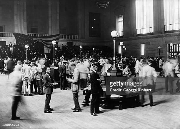 Photograph showing stock traders on the floor of the New York Stock Exchange in 1928.