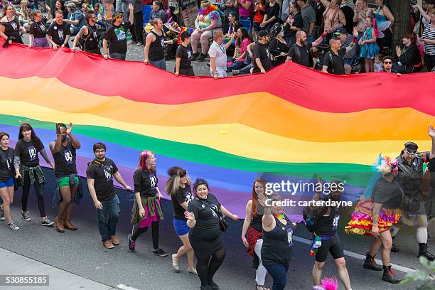 seattle gay pride festival 40th anniversary celebration and flag - 40th annual seattle pride parade stock pictures, royalty-free photos & images