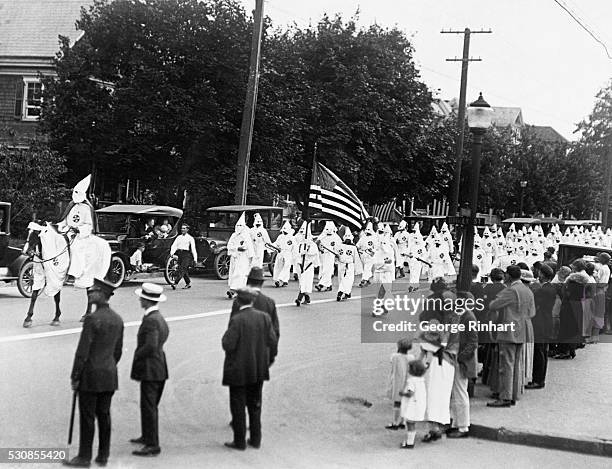 Photo shows some of the four thousand Klansmen that marched in the parade down Broadway, Long Branch yesterday. The parade was viewed in silence by...