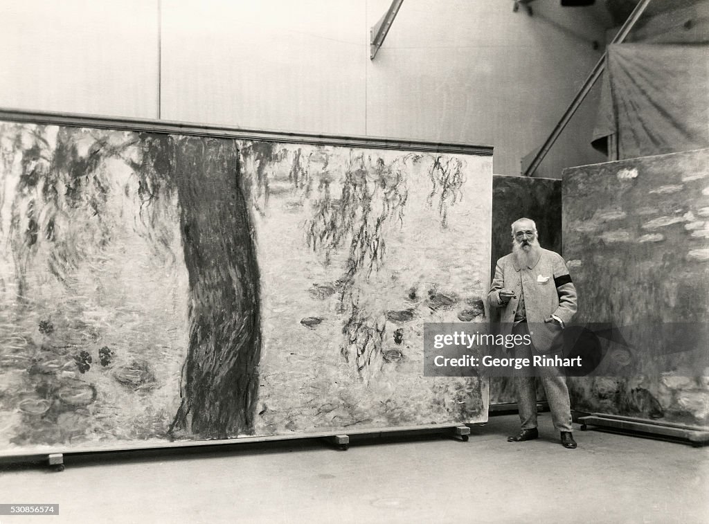 Claude Monet Stands Next to Mural Panel in Studio
