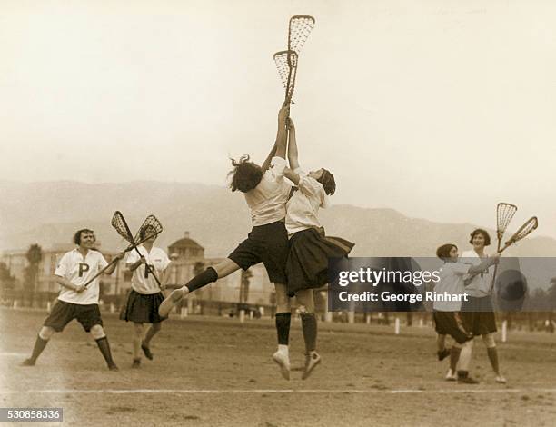 Splendid action of a spirited scramble for the ball during a practice game between the first and second Huron teams in preparation for the national...
