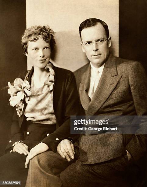 Amelia Earhart and her husband, George Palmer Putnam, are shown seated.