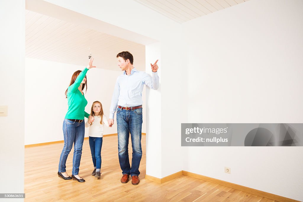 Family of three are happy with their new apartment