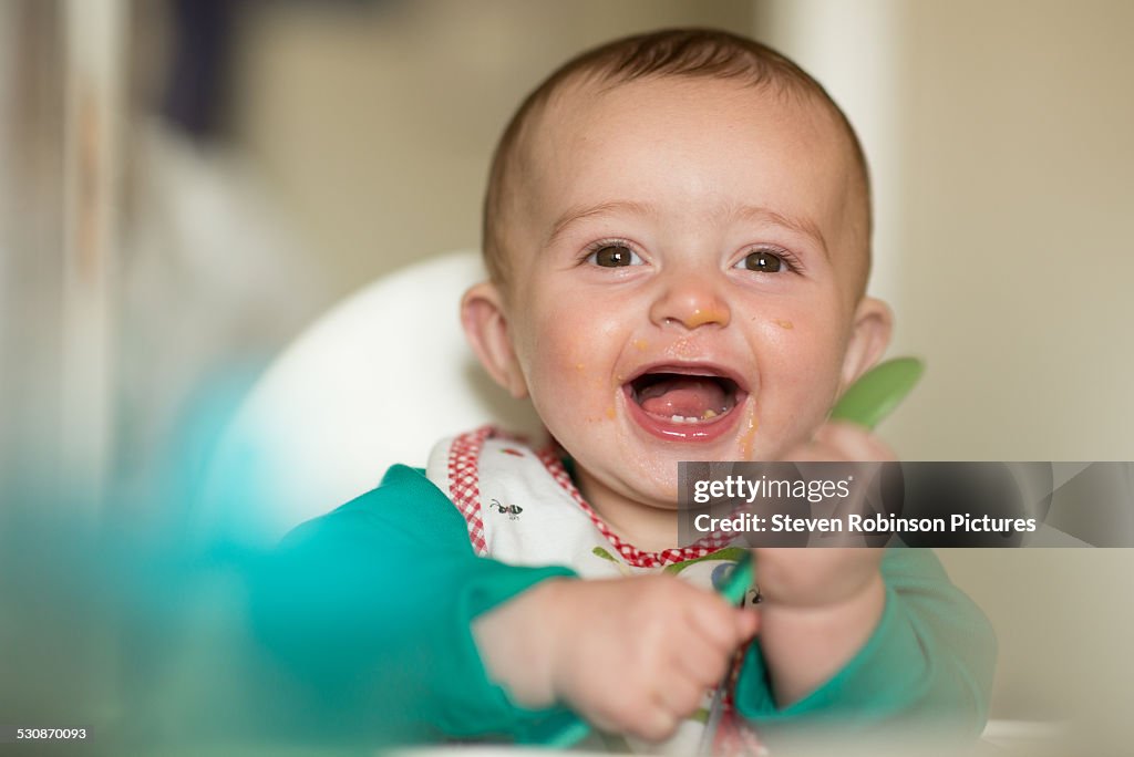 Baby eating with Spoon