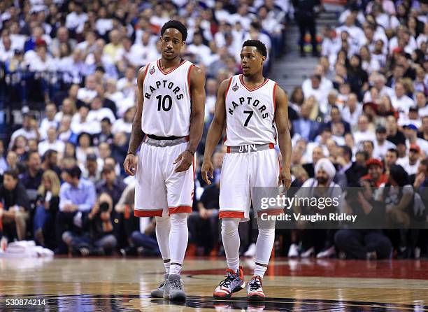 DeMar DeRozan and Kyle Lowry of the Toronto Raptors talk in the first half of Game Five of the Eastern Conference Semifinals against the Miami Heat...