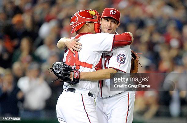 Max Scherzer of the Washington Nationals celebrates with Wilson Ramos after tying the MLB record for strikeouts in a game with 20 against the Detroit...