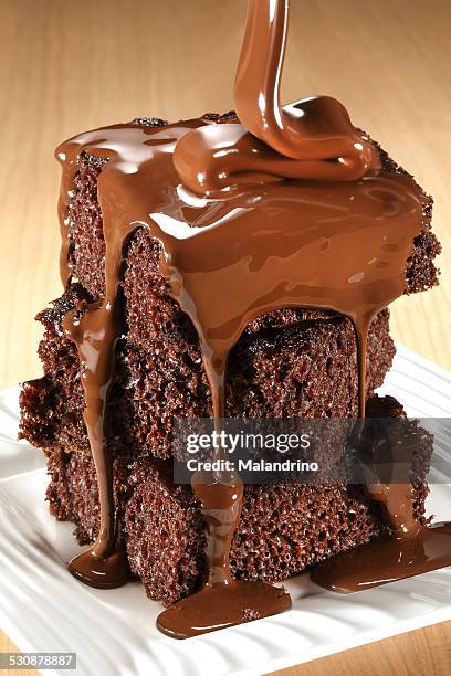 chocolate brownie with fudge - fudge sauce stock pictures, royalty-free photos & images
