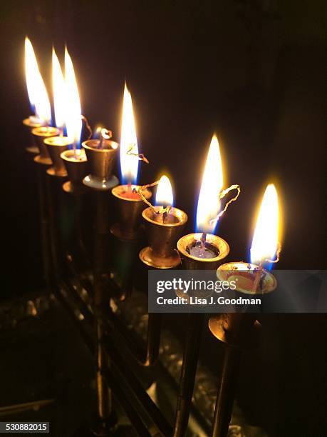 hanukkah menorahs  - burning the candle at both ends stock pictures, royalty-free photos & images