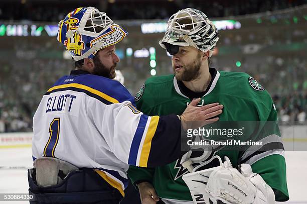 Brian Elliott of the St. Louis Blues and Antti Niemi of the Dallas Stars talk after the Blues won 6-1 in Game Seven of the Western Conference Second...