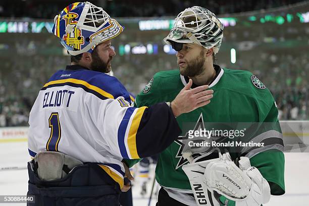 Brian Elliott of the St. Louis Blues and Antti Niemi of the Dallas Stars talk after the Blues won 6-1 in Game Seven of the Western Conference Second...