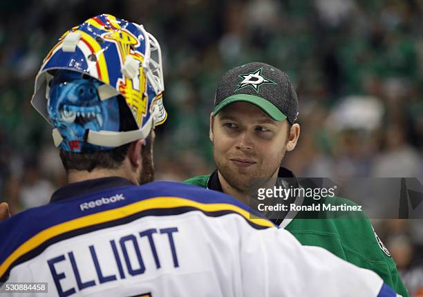 Brian Elliott of the St. Louis Blues shakes hands with Kari Lehtonen of the Dallas Stars after the Blues won 6-1 in Game Seven of the Western...