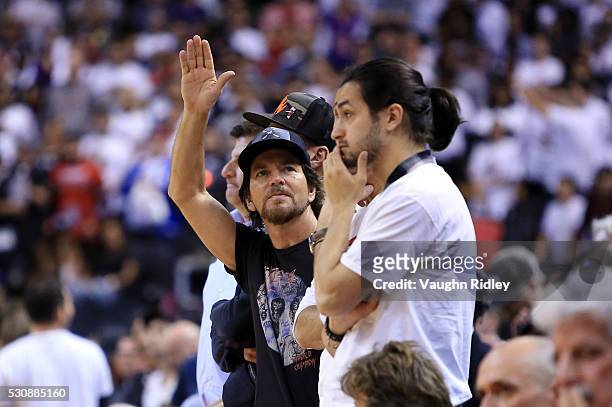 Lead Singer of rock band Pearl Jam, Eddie Vedder, waves to the crowd in the second half of Game Five of the Eastern Conference Semifinals between the...