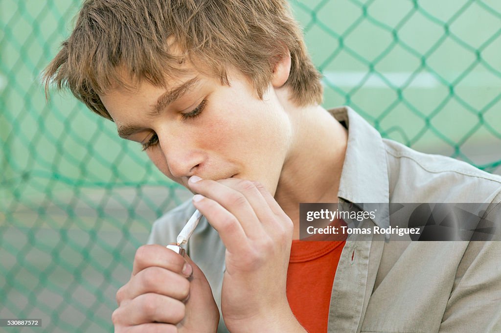 Teen boy smoking