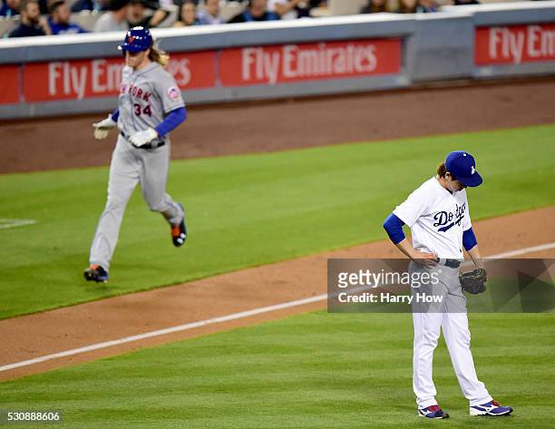 Kenta Maeda of the Los Angeles Dodgers reacts as Noah Syndergaard of the New York Mets runs home after his three run homerun and second homerun of...