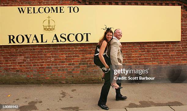 Rman gives a lady race goer a piggy back ride home after attending the third day, Ladies Day of Royal Ascot 2005 at York Racecourse on June 16, 2005...